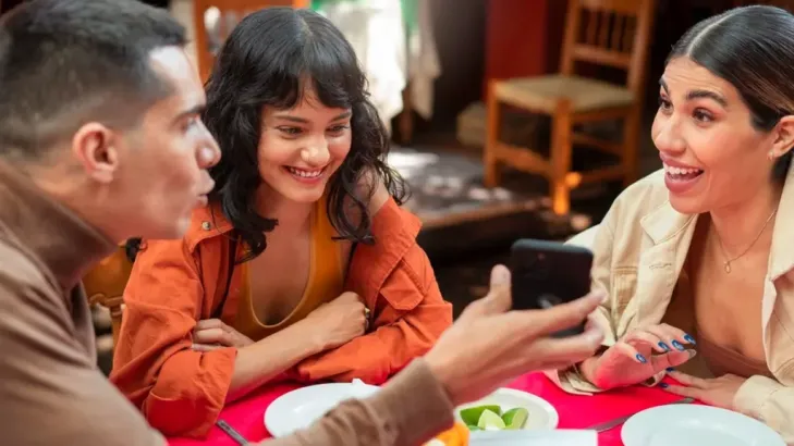 Is QNET a scam? Friends on a table